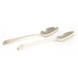 A pair of old English pattern silver serving spoons,