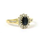 An 18ct gold sapphire and diamond oval cluster ring