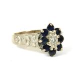 An 18ct white gold diamond and sapphire oval cluster ring