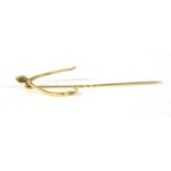 A Victorian gold wishbone form stick pin