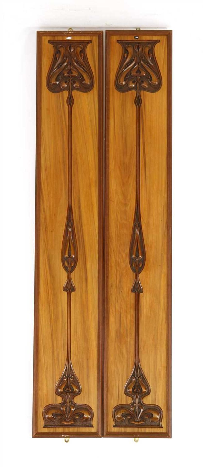 A pair of carved rosewood Secessionist wall panels,