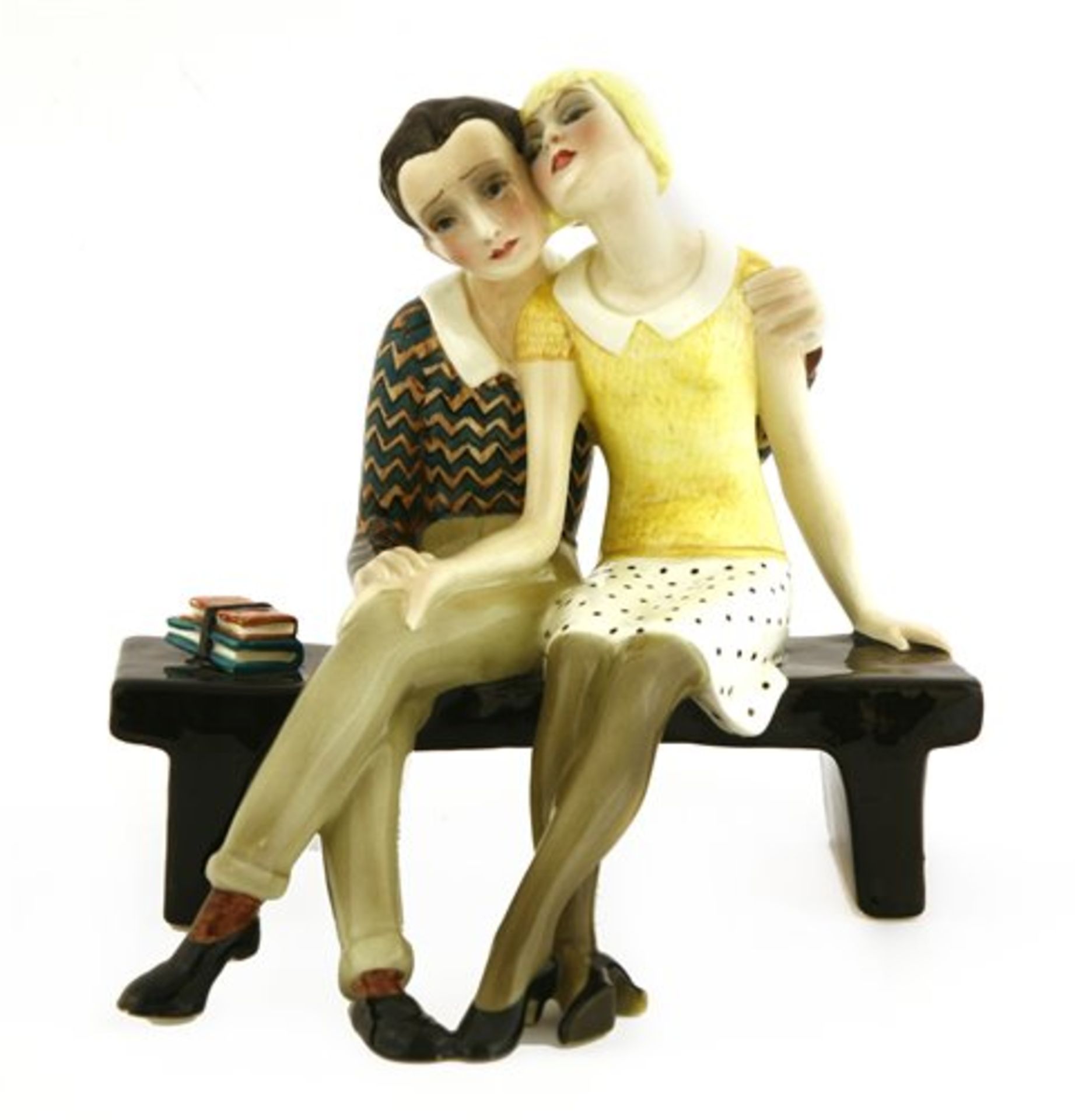 A Lenci figure of a couple rested on a bench,