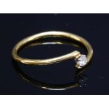 An 18ct gold single stone diamond stacking ring