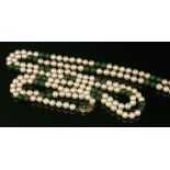 A single row uniform cultured pearl and jade bead necklace