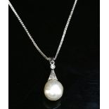 A natural saltwater pearl and diamond pendant,