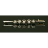 A Continental Art Deco five stone diamond bar brooch,