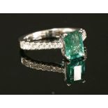 A Continental white gold single stone emerald ring
