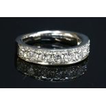 A platinum diamond set half eternity ring,