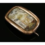 A Georgian gold cased masonic brooch of elongated cushion form,