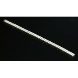 An 18ct white gold two row diamond line bracelet