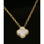 A gold mother of pearl pendant,