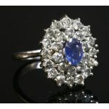 An Italian white gold sapphire and diamond oval cluster ring