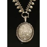 A Victorian silver hinged oval locket