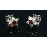 A pair of 18ct white gold ruby and diamond cluster earrings