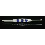 An Art Deco white gold sapphire and diamond bar brooch