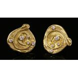 A pair of 18ct gold diamond set earrings,