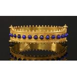 An Italian cased gold Etruscan or archaeological revival bangle,