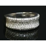 An 18ct white gold pavé set diamond half hoop ring