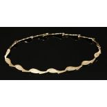 A 9ct gold articulated plaque link necklace