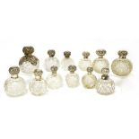 Twelve assorted silver and cut glass scent bottles,