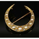 An Edwardian gold split pearl and diamond crescent brooch,