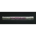 A French Art Deco ruby and diamond bar brooch