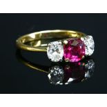 An 18ct gold three stone ruby and diamond ring by Kutchinsky