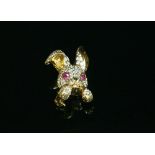An 18ct gold ruby and diamond novelty rabbit brooch, by David Morris,