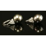 A pair of Continental white gold Tahitian cultured pearl and diamond drop earrings