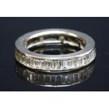 A white gold baguette diamond full eternity ring