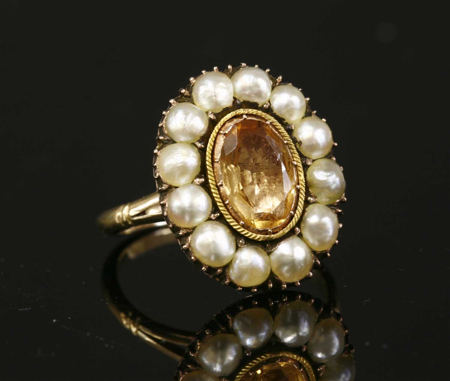 A Georgian foiled topaz and split pearl cluster,