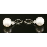 A pair of Continental white gold cultured South Sea pearl and diamond drop earrings