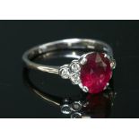 An 18ct white gold ruby and diamond seven stone ring,