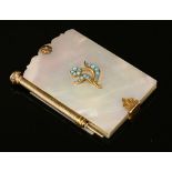 A gold mother of pearl, turquoise and gold cased aide de memoire,