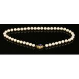 A single row uniform cultured pearl necklace