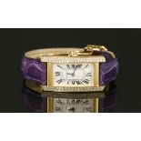 A ladies 18ct gold Cartier Tank Americaine quartz strap watch
