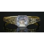 A Belle Époque gold and diamond set painted miniature plaque bracelet, c.1915,