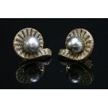 A pair of gold Tahitian cultured pearl and diamond clam shell style earrings