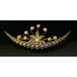 A late Victorian gold seed pearl and split pearl crescent brooch,