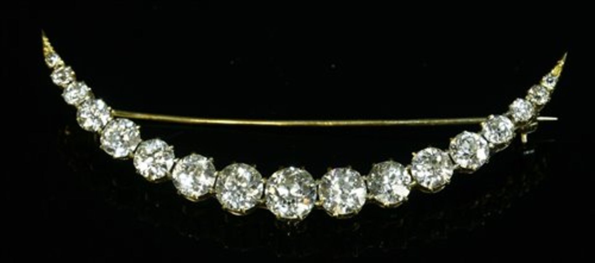 A late Victorian diamond set crescent brooch