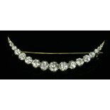 A late Victorian diamond set crescent brooch