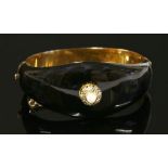 A Victorian gold, pearl, diamond and enamel memorial hinged bangle