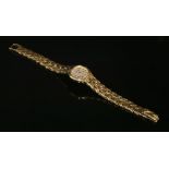 A ladies 18ct gold Patek Philippe quartz La Flamme bracelet watch