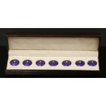 A cased gold and silver set of seven blue enamel dress buttons,
