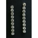A pair of 18ct white gold diamond drop earrings,