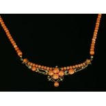 An Edwardian coral and simulated pearl necklace