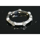 A cased platinum diamond set band ring, by David Morris,