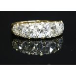 A Victorian five stone carved head diamond ring