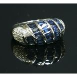 A Continental white gold sapphire and diamond bombe ring,