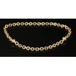 A gold hollow trace link necklace and bracelet suite